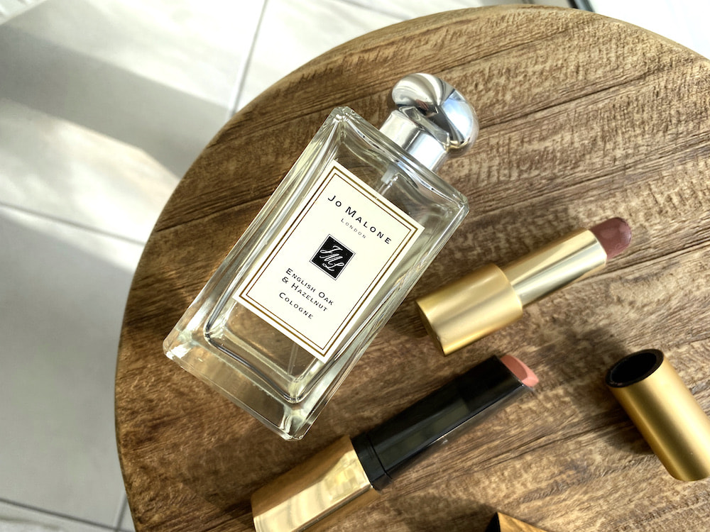 beautyproducts Flat lay of jo malone fragrance, lisa eldridge lipstick in fawn and hourglass vanish blush stick